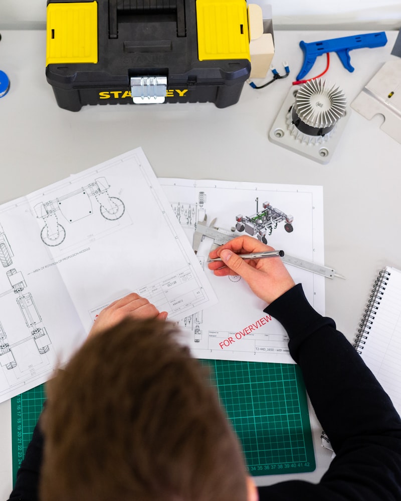 A field-service worker checking a job on custom software on-site.